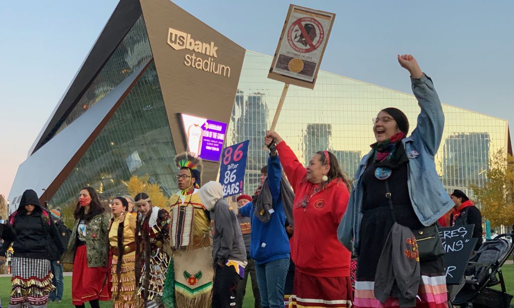 Indigenous people gather outside of the U.S. Bank stadium in Minneapolis to protest the visiting Washington Football team’s racist mascot. (October 24, 2019) Photo by Sarah Manning.